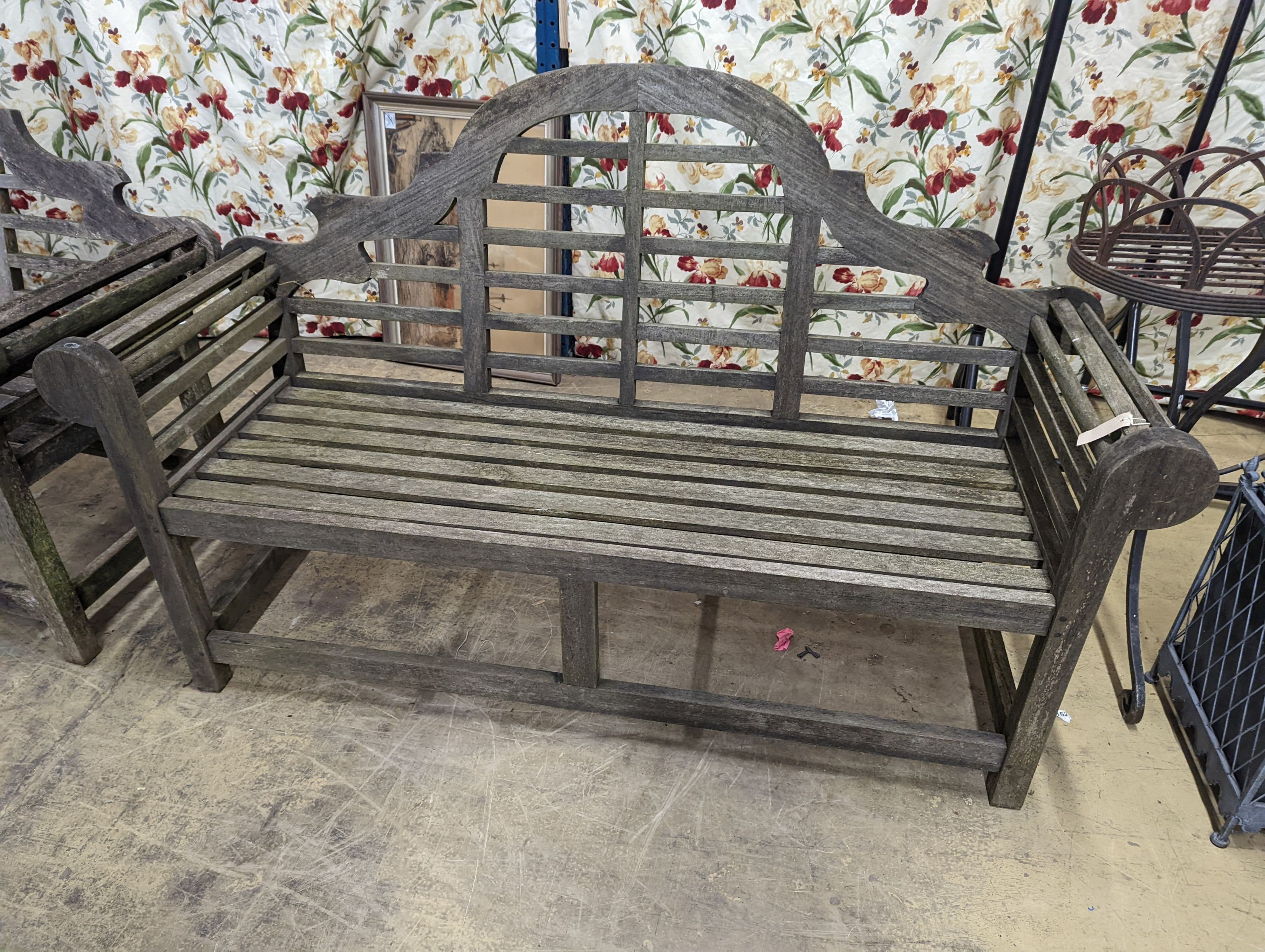 A pair of Lutyens style weathered teak garden benches, length 166cm, depth 53cm, height 105cm